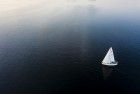 Sailing boat during sunset on lake Gooimeer