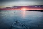 Sailing home on lake Gooimeer during sunset