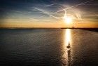 Sailing boat during sunset on lake Gooimeer