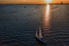 Sailing boat on lake Gooimeer during sunset