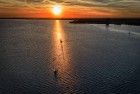 Sailing boat during sunset on lake Gooimeer during sunset