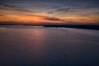 Lonely sailing boats on lake Gooimeer during sunset