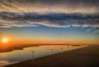 Fields, windmill and lake Eemmeer from my drone during sunset