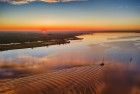 Sunset drone picture of lake Eemmeer, as a boat passes