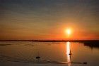 Boats on lake Gooimeer during sunset