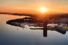 Drone panorama of sailing boats on lake Gooimeer during sunset