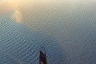 Sailing boat on lake Gooimeer during sunset