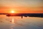 Sailing boats on lake Gooimeer during sunset