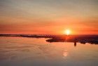 Sailing boats on lake Gooimeer during sunset