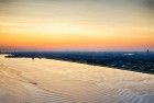 Boats sailing on lake Gooimeer during sunset