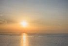 Boats sailing on lake Markermeer during sunset