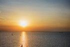 Sailing boat on lake Markermeer during sunset