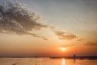 Boats on lake Gooimeer during sunset