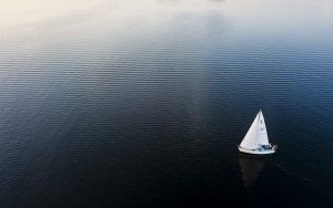 Sailing boat during sunset on lake Gooimeer