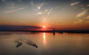 Speedboats during sunset