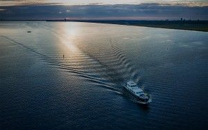 Motor boat cruising over lake Gooimeer