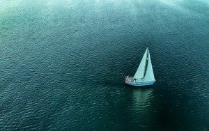 Lonely boat on lake Gooimeer during sunset