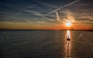 Sailing boat silhouette during sunset