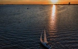 Sailing boat on lake Gooimeer during sunset