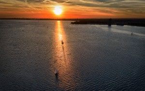 Sailing boat during sunset on lake Gooimeer during sunset