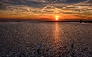 Sailing boats on Gooimeer during sunset