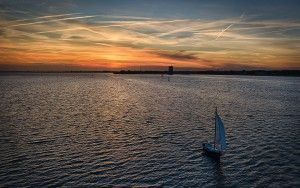 Sailing boat during sunset on lake Gooimeer