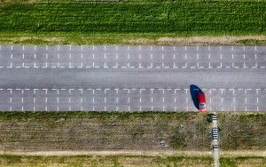 Top-down drone picture of an almost empty parking lot