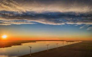 Fields, windmill and lake Eemmeer from my drone during sunset