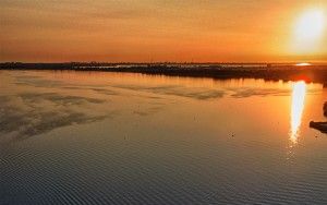 Sailing boat on lake Gooimeer during sunset