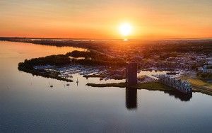 Drone panorama of sailing boats on lake Gooimeer during sunset