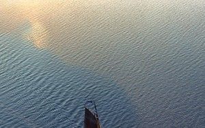 Sailing boat on lake Gooimeer during sunset