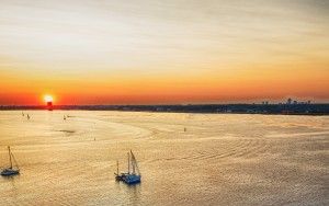 Boats on lake Gooimeer during sunset