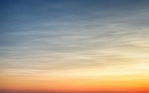 Sailing boats on lake Gooimeer during sunset