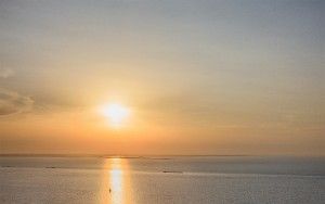 Boats sailing on lake Markermeer during sunset