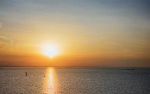 Sailing boat on lake Markermeer during sunset