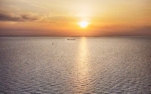 Sailing on lake Markermeer during sunset