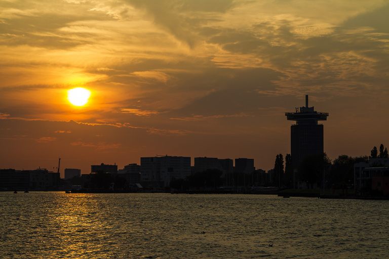 Sunset over the IJ river in Amsterdam