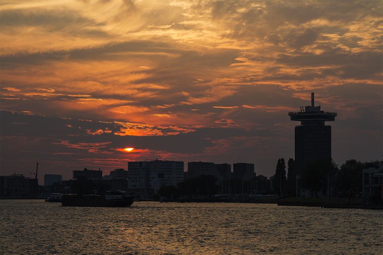 Sunset over the IJ river in Amsterdam