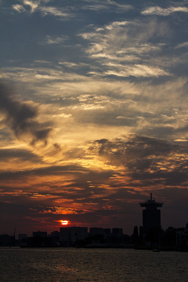 Sunset over the IJ river in Amsterdam