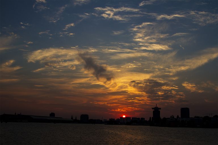 Sunset over the IJ river in Amsterdam