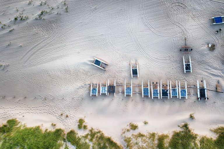 Boats on the beach during sunset