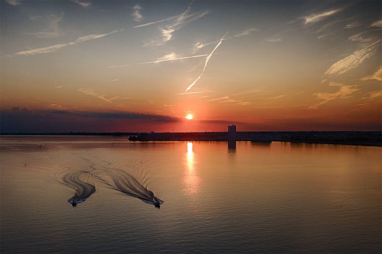 Speedboats during sunset