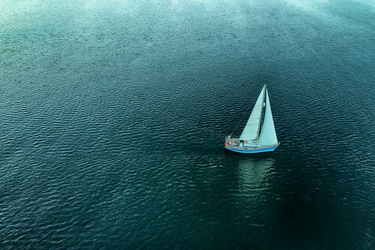 Lonely boat on lake Gooimeer during sunset