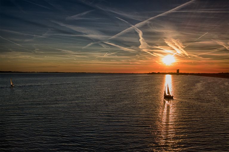 Sailing boat silhouette during sunset