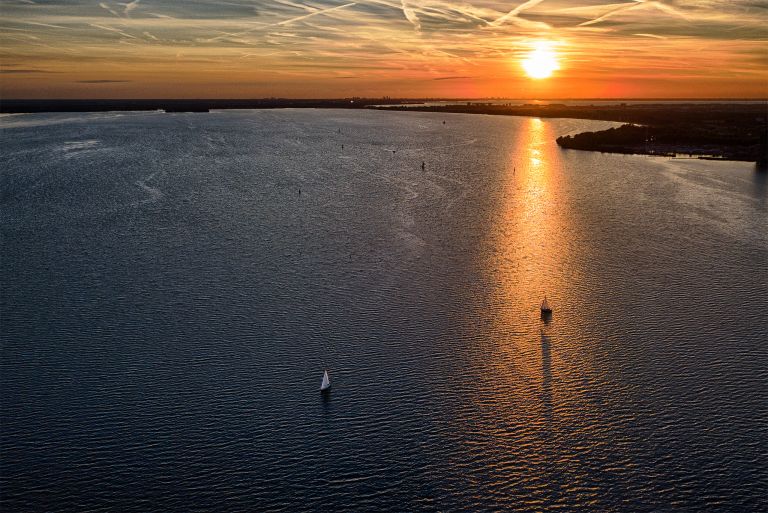 Sunset drone flight over lake Gooimeer