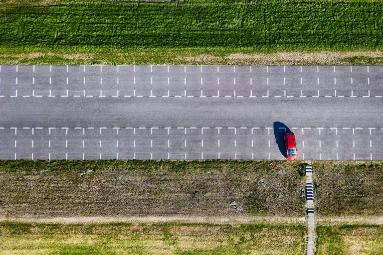 Top-down drone picture of an almost empty parking lot