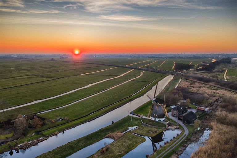 Drone sunset over the fields near Weesp