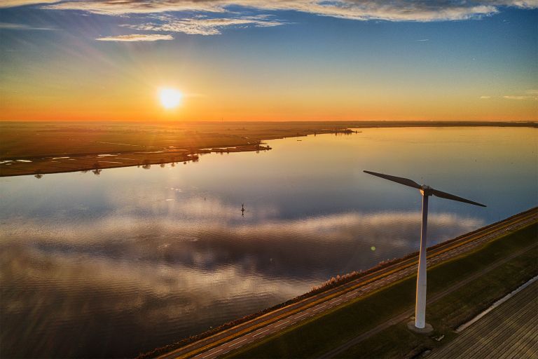 Sunset drone picture of windmill on Eemmeerdijk