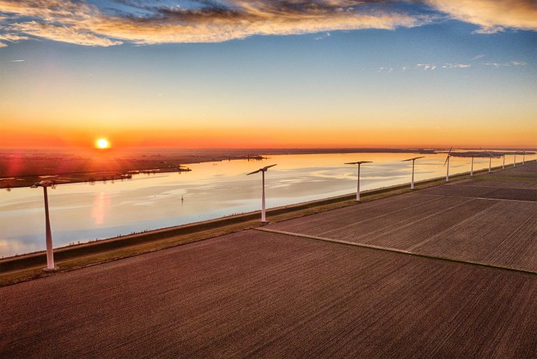 Sunset drone picture of lake Eemmeer and the windmills on Eemmeerdijk