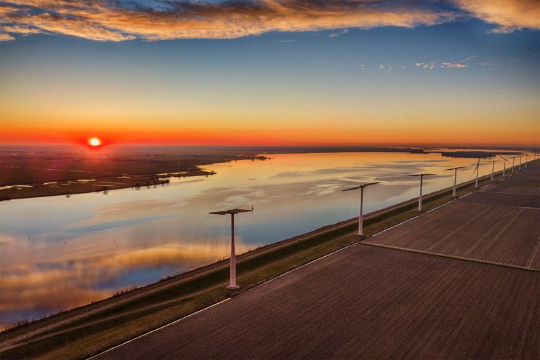 Sunset drone picture of lake Eemmeer and the windmills on Eemmeerdijk